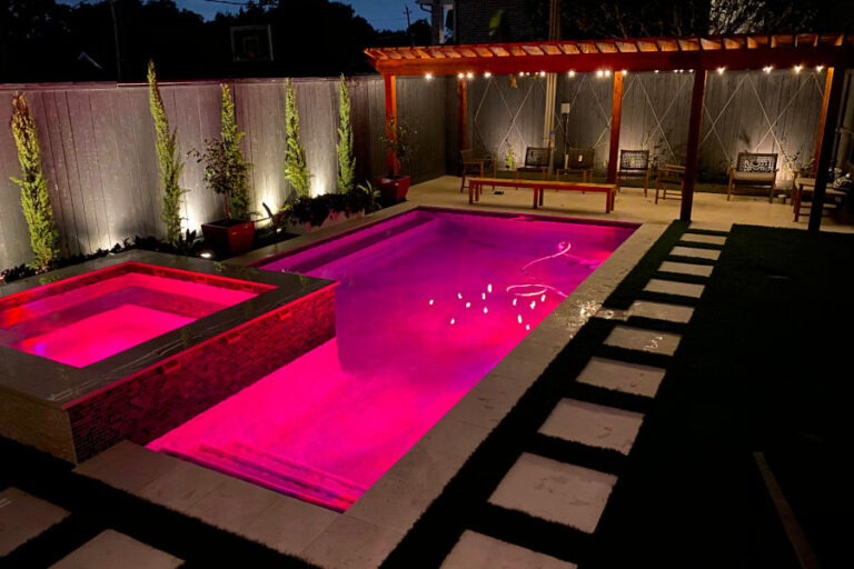 A pool with pink lights and white walls